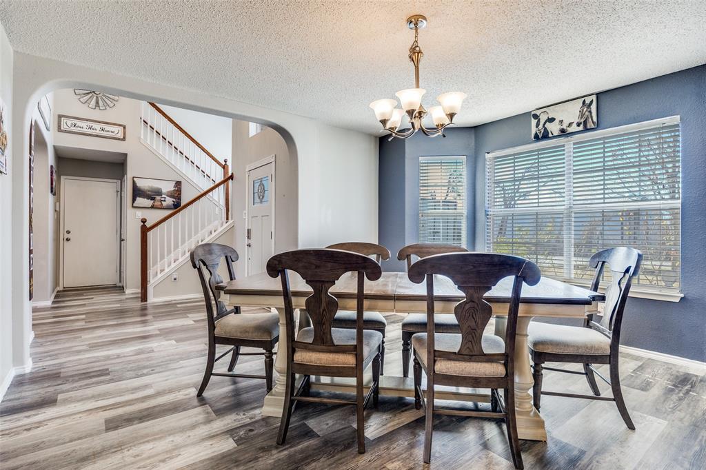 1026 County Road 544 Nevada, TX 75173 - Photo 4 of 32 a view of a dining room with furniture and chandelier