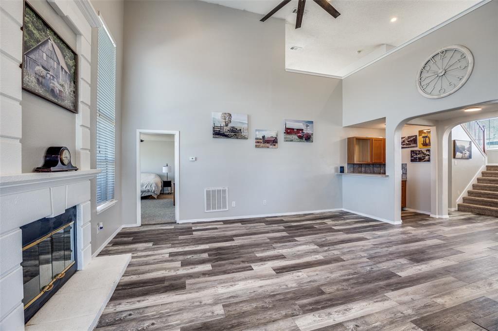 1026 County Road 544 Nevada, TX 75173 - Photo 5 of 32 a view of a livingroom with wooden floor and a ceiling fan