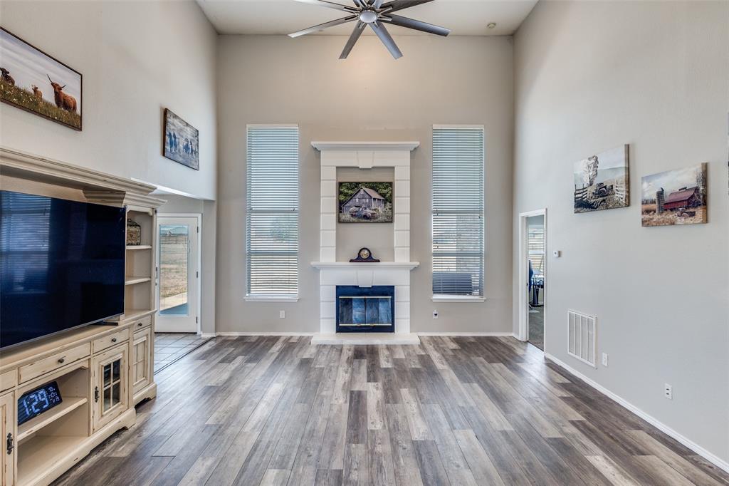 1026 County Road 544 Nevada, TX 75173 - Photo 6 of 32 a living room with furniture fireplace and flat screen tv