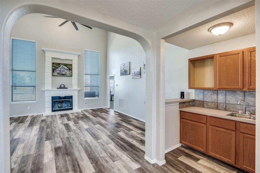 1026 County Road 544 Nevada, TX 75173 - Photo 7 of 32 a view of a kitchen with microwave and cabinets