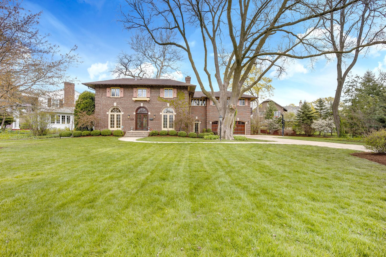 293 Longcommon Road Riverside, IL 60546 - Photo 1 of 4 a large building with trees in front of it