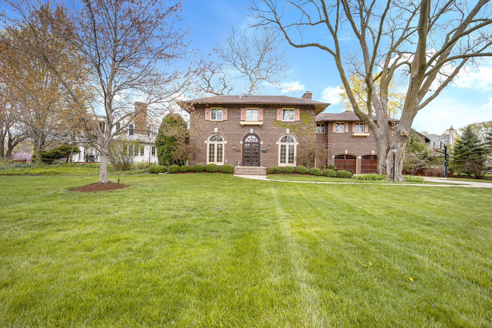 293 Longcommon Road Riverside, IL 60546 - Photo 3 of 4 a front view of house with yard and green space