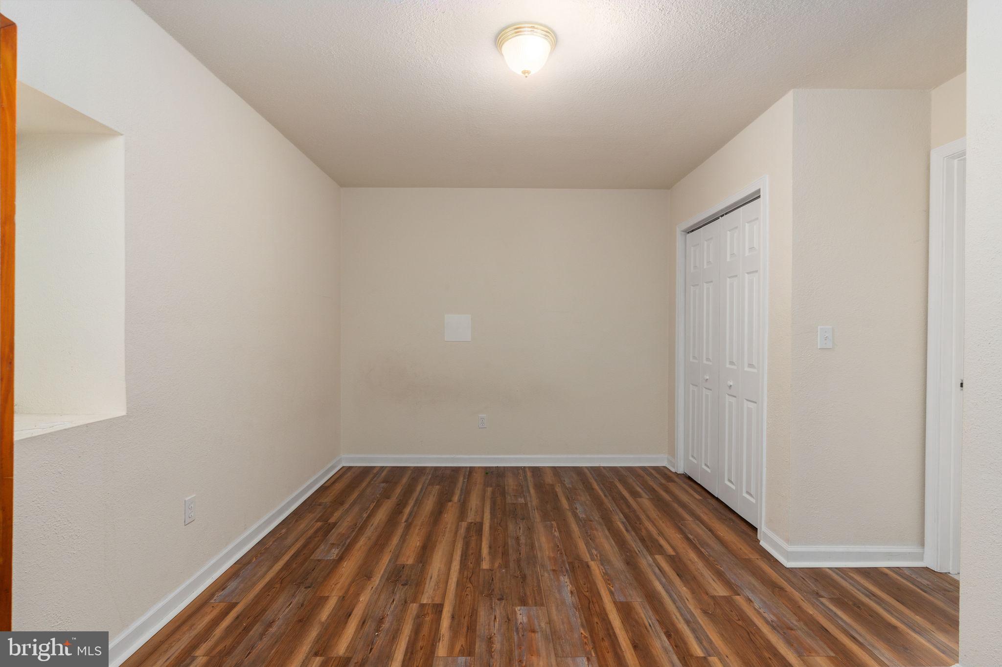 8009 Burrell Road Fredericksburg, VA 22407 - Photo 36 of 66 Spacious room with modern flooring.