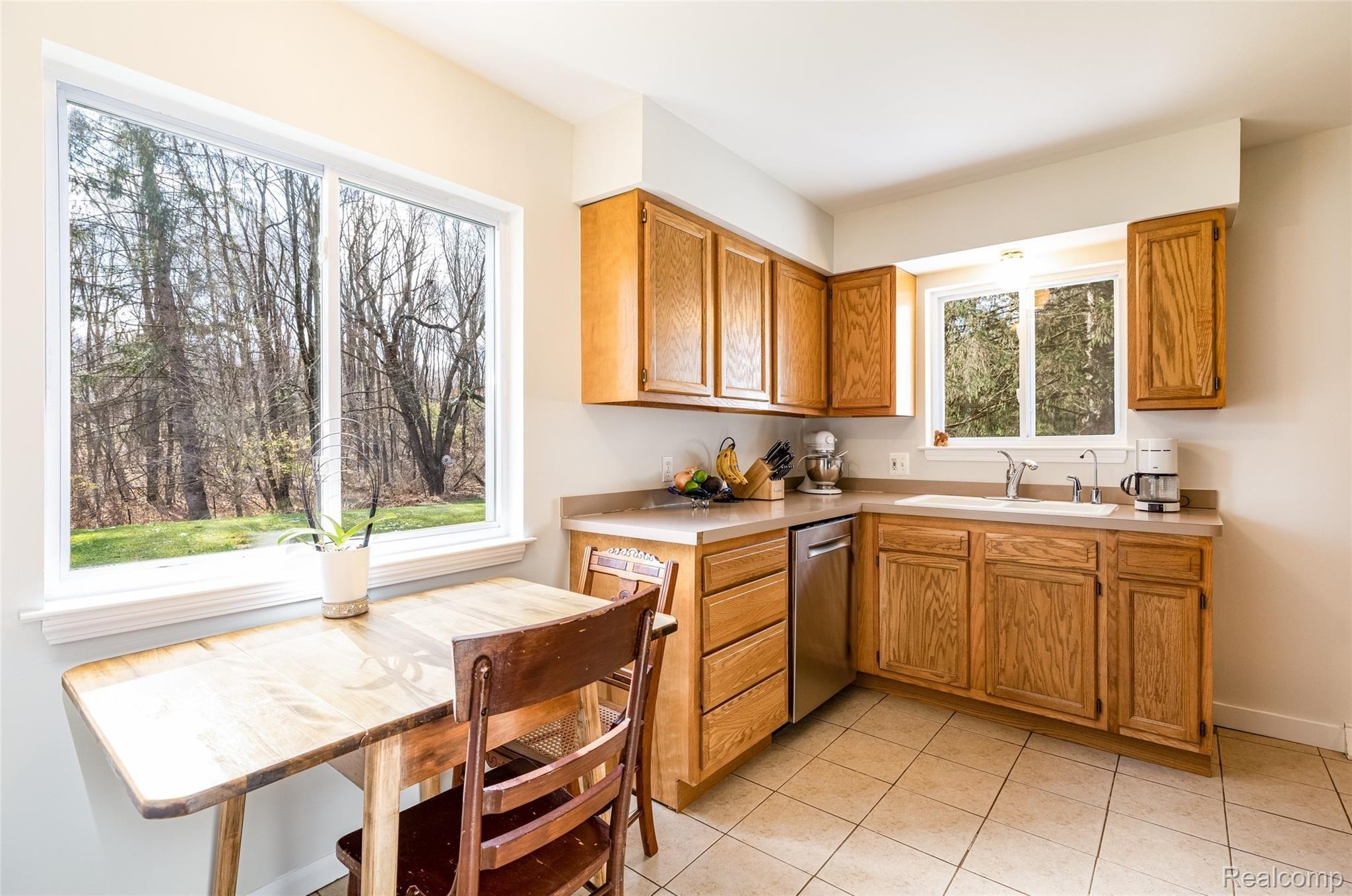 5911 Bullard Road Fenton, MI 48430 - Photo 20 of 36 Great views to rear yard from sink & dining