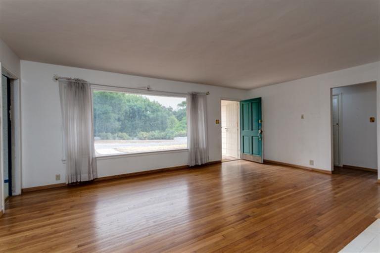 403 Del Norte Road Ojai, CA 93023 - Photo 3 of 22 a view of an empty room with wooden floor and a window