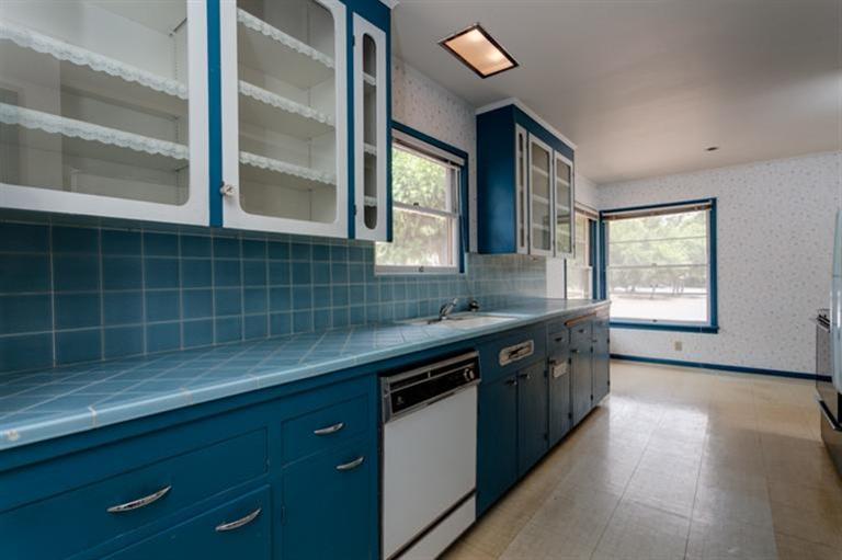 403 Del Norte Road Ojai, CA 93023 - Photo 7 of 22 a kitchen with stainless steel appliances granite countertop a sink a stove and a wooden floors
