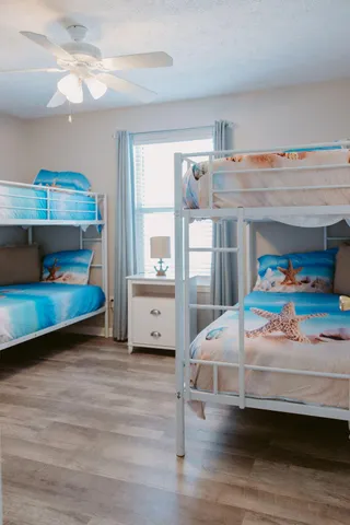 a bedroom with furniture and a baby crib