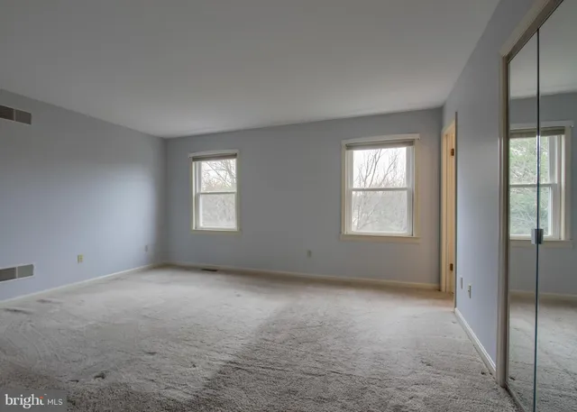 an empty room with windows