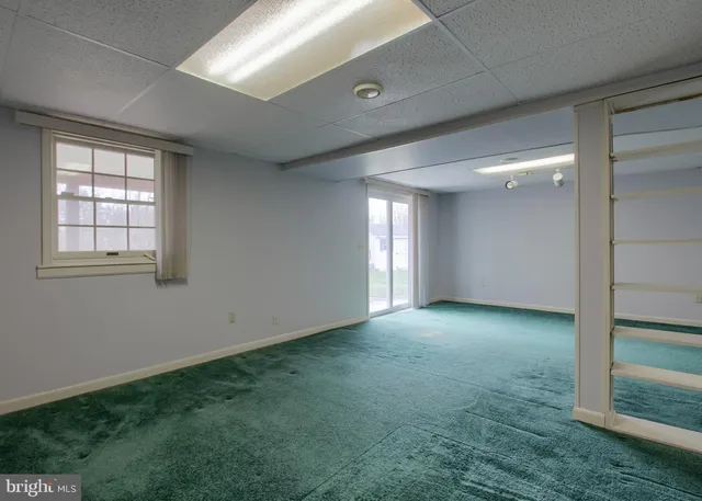 a view of a big room with windows