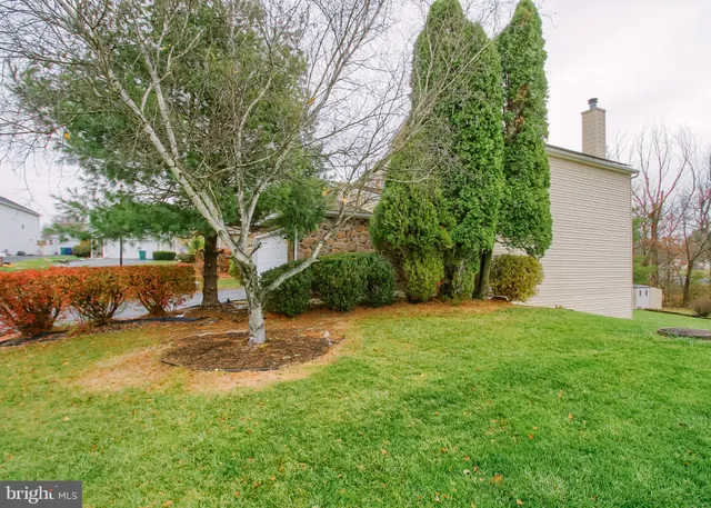a backyard of a house with lots of green space