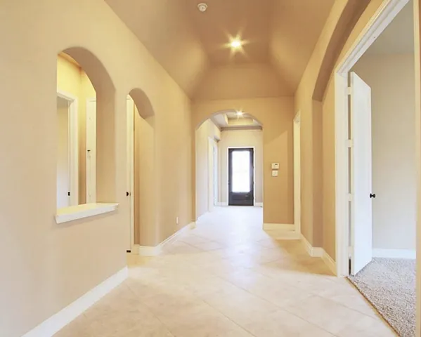 a view of a room with wooden floor and window