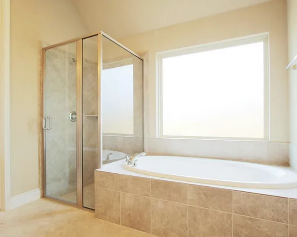 a bathroom with a shower and a sink