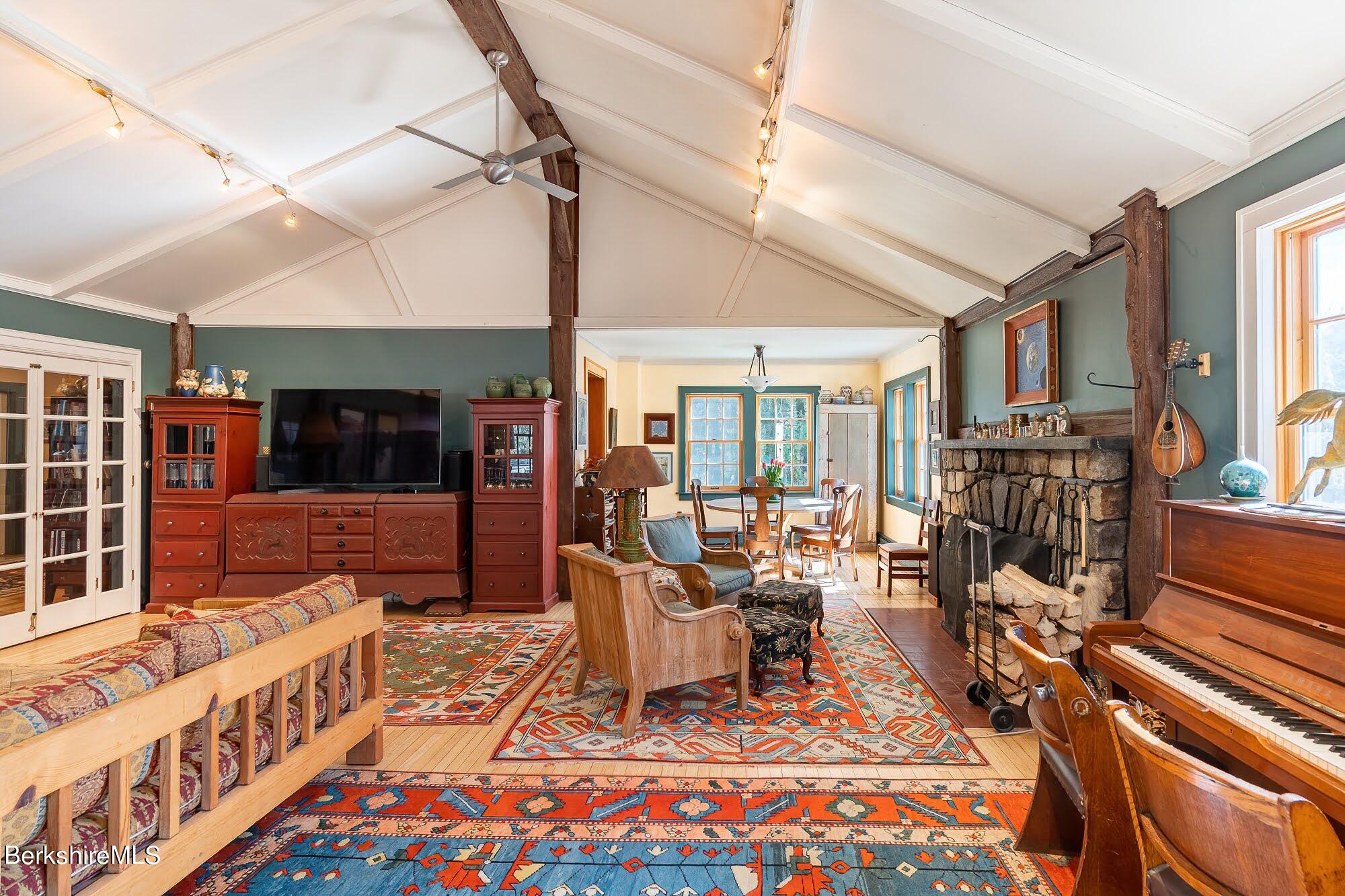 17 Cronk Road Monterey, MA 01245 - Photo 11 of 56 a living room with furniture a flat screen tv and a table