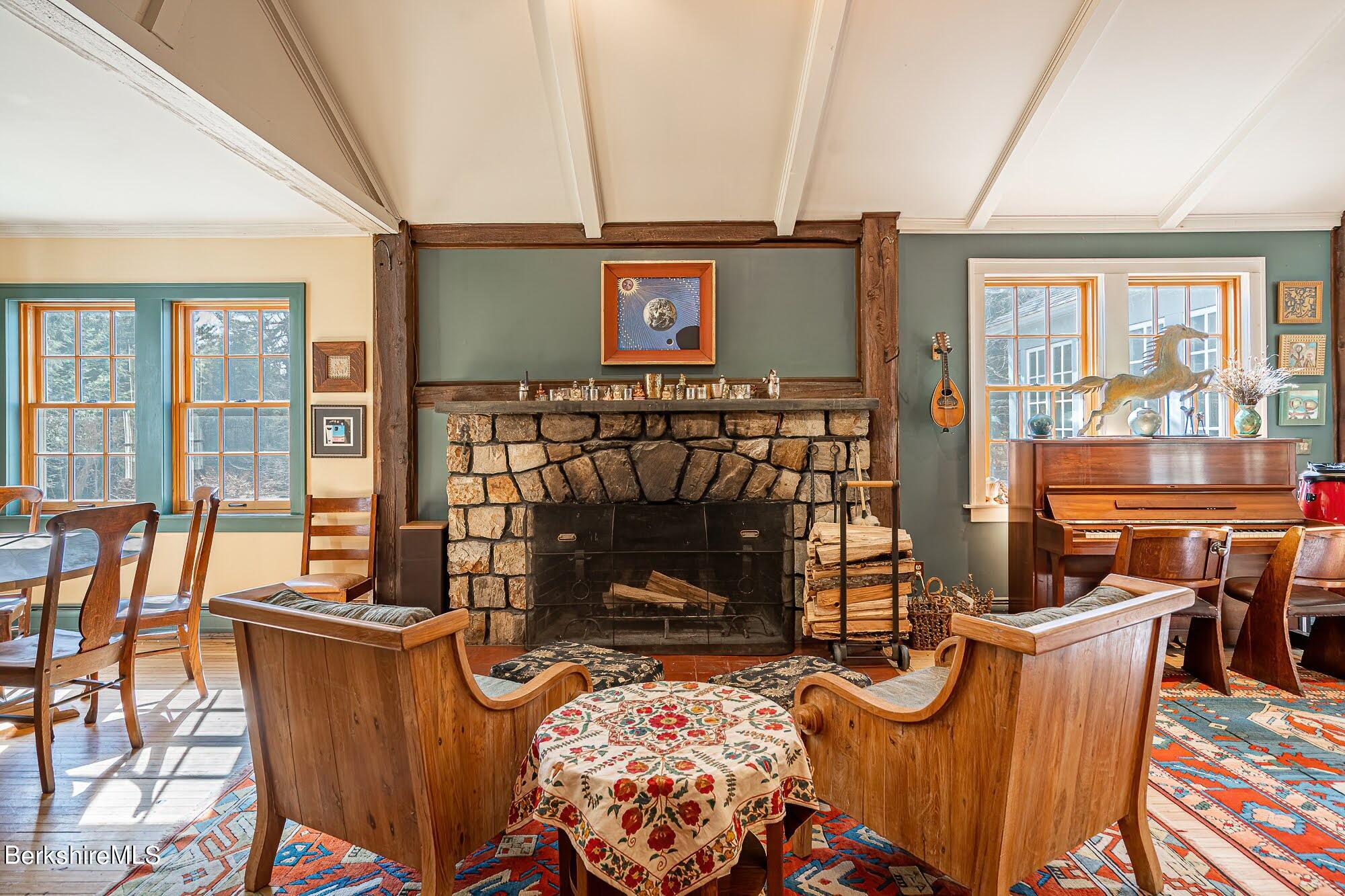 17 Cronk Road Monterey, MA 01245 - Photo 14 of 56 a living room with furniture a fireplace and city view