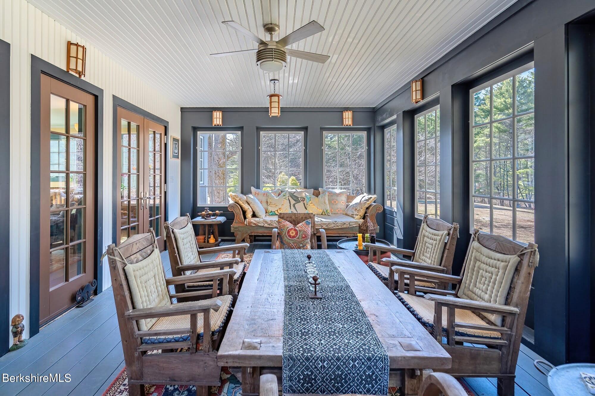 17 Cronk Road Monterey, MA 01245 - Photo 25 of 56 a living room with furniture two large windows and a chandelier