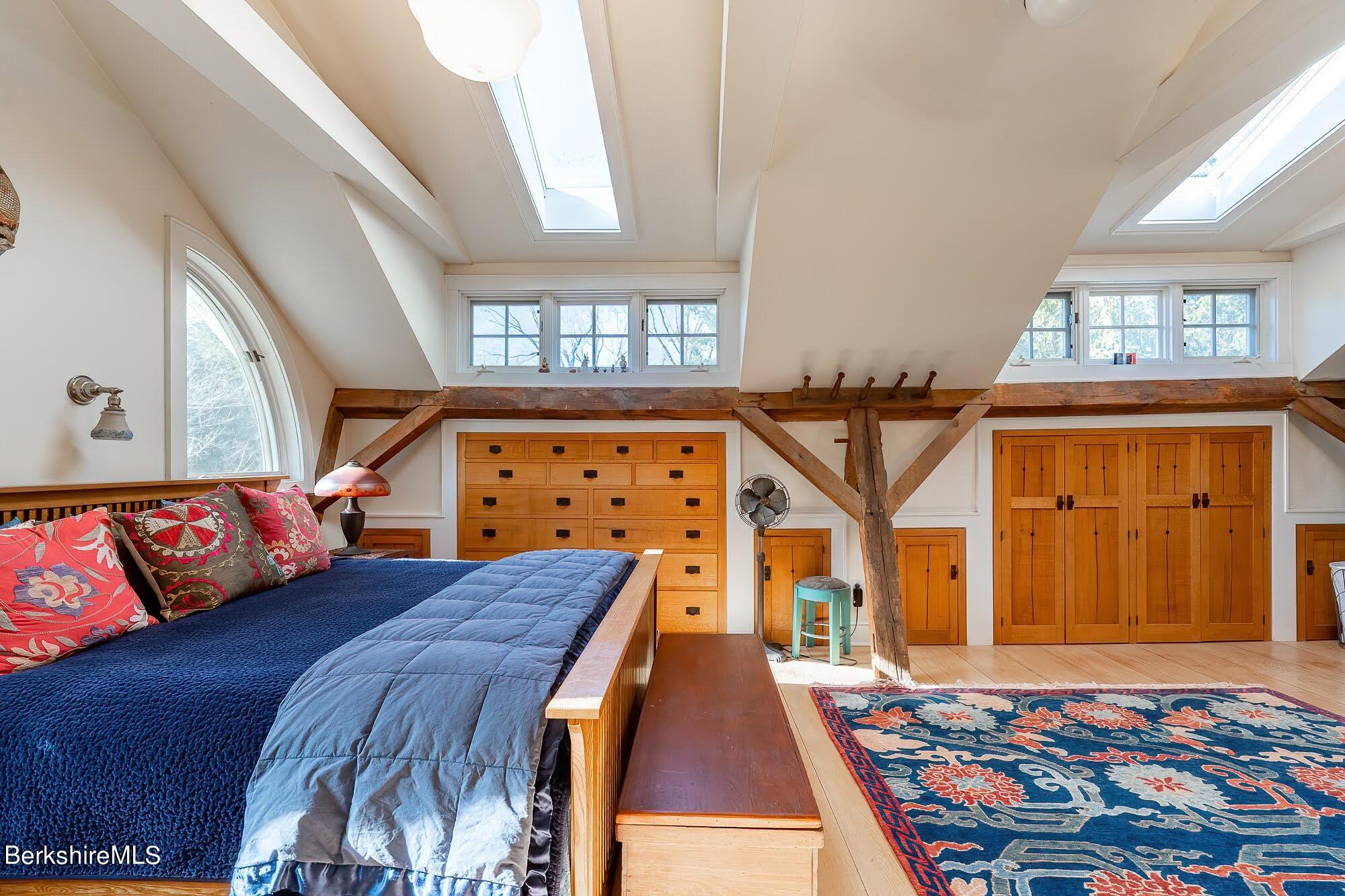 17 Cronk Road Monterey, MA 01245 - Photo 36 of 56 a bedroom with a bed and wooden floor