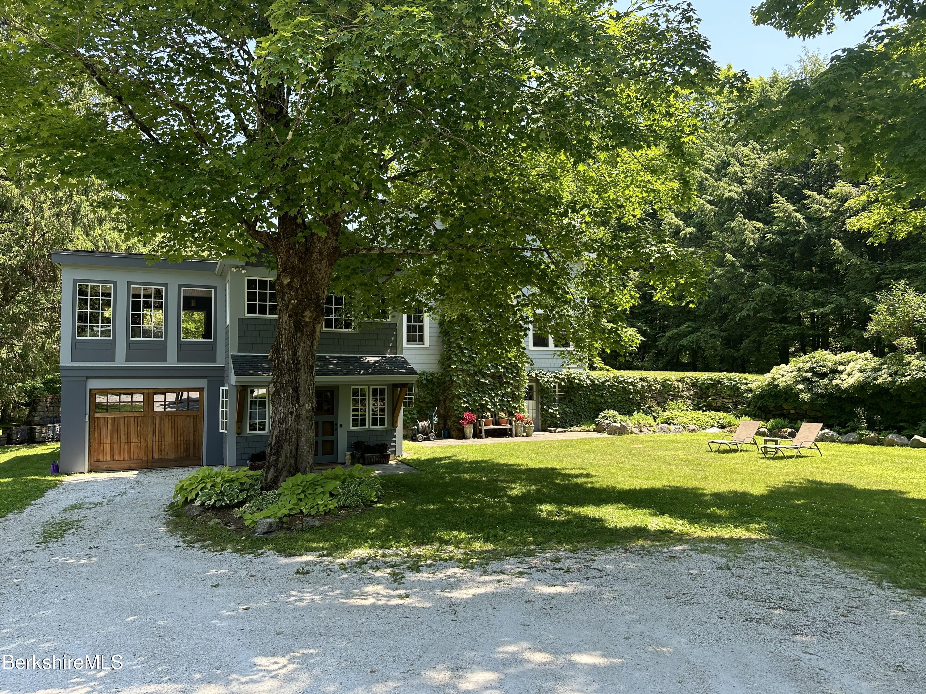 17 Cronk Road Monterey, MA 01245 - Photo 4 of 56 a front view of a house with a yard
