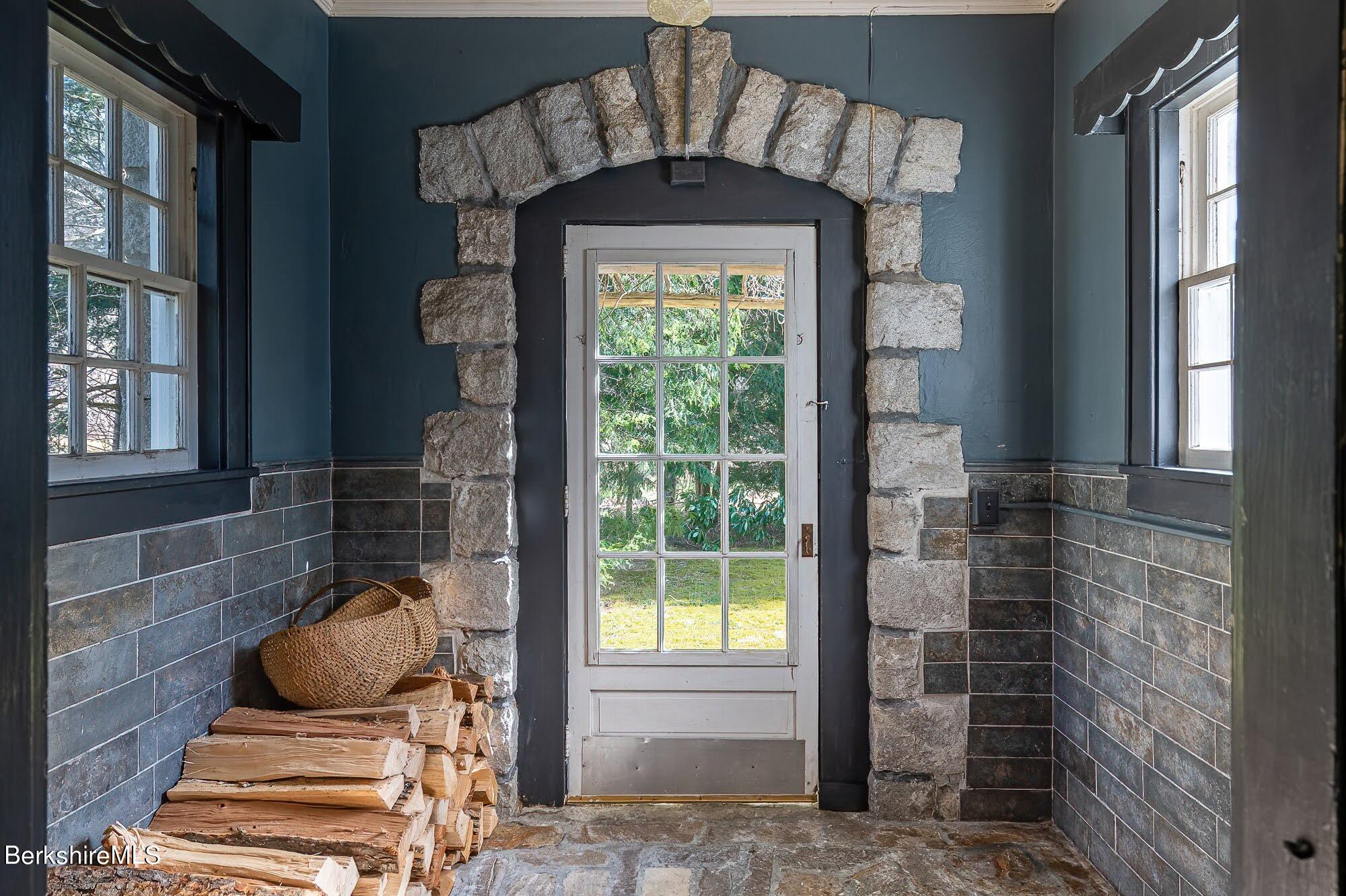 17 Cronk Road Monterey, MA 01245 - Photo 8 of 56 a front door view of a house with a glass door