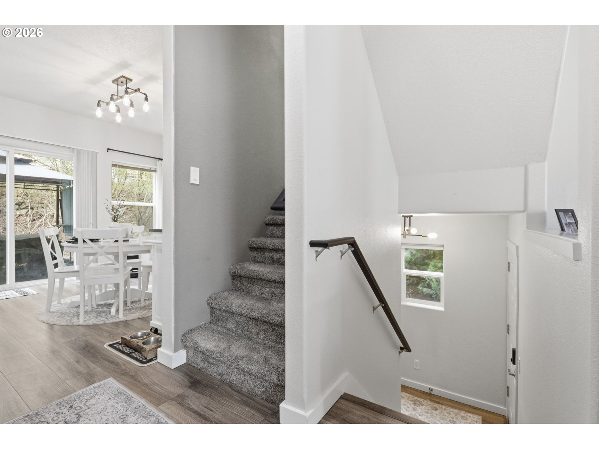 15095 Southwest Warbler Way, Unit 104 Beaverton, OR 97007 - Photo 16 of 46 a view of an entryway with wooden floor
