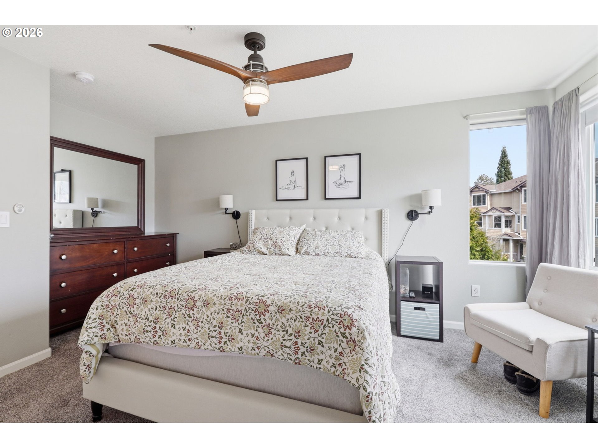 15095 Southwest Warbler Way, Unit 104 Beaverton, OR 97007 - Photo 19 of 46 a bedroom with a bed and a couch