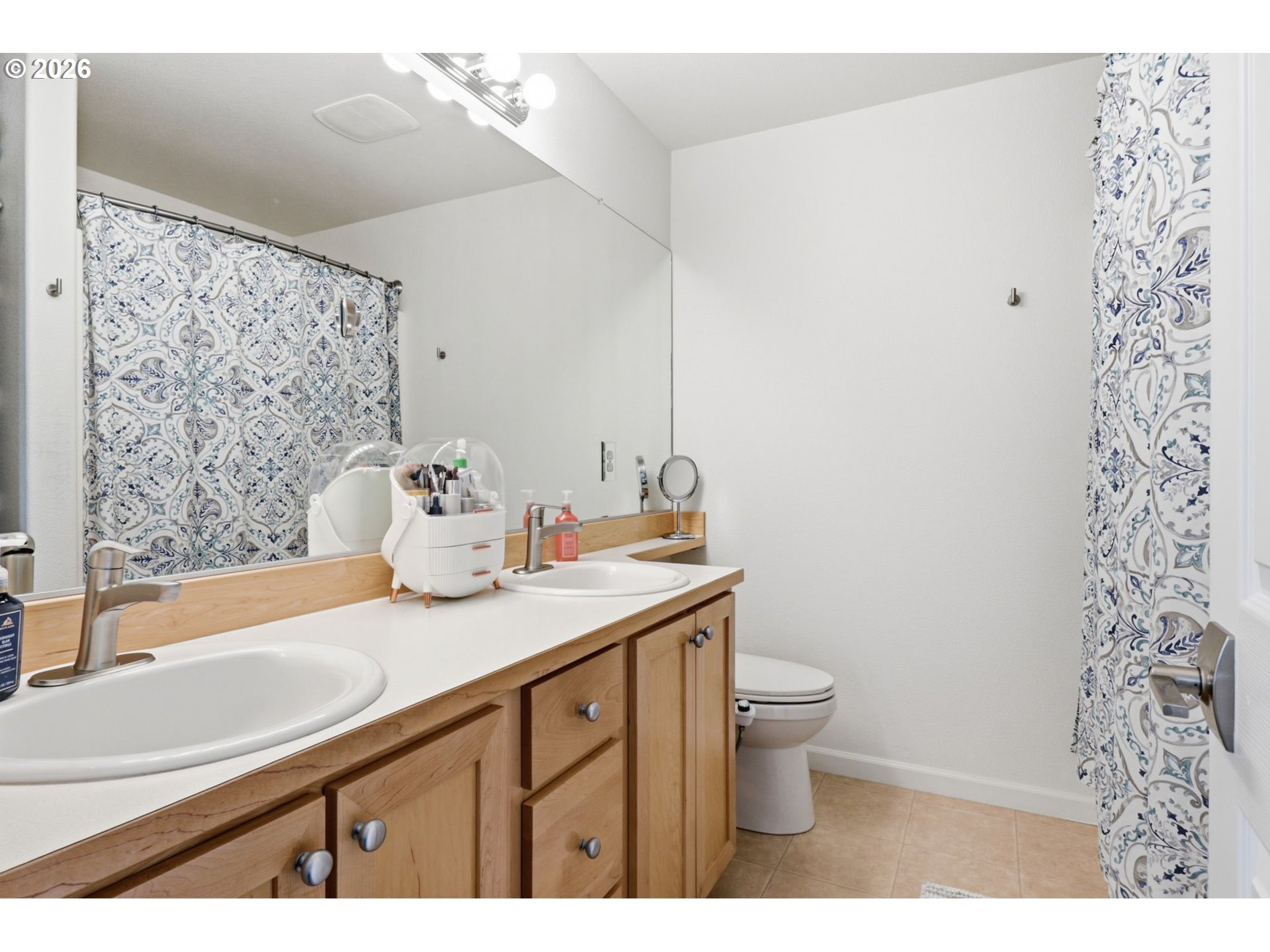 15095 Southwest Warbler Way, Unit 104 Beaverton, OR 97007 - Photo 22 of 46 a bathroom with a sink a toilet and shower