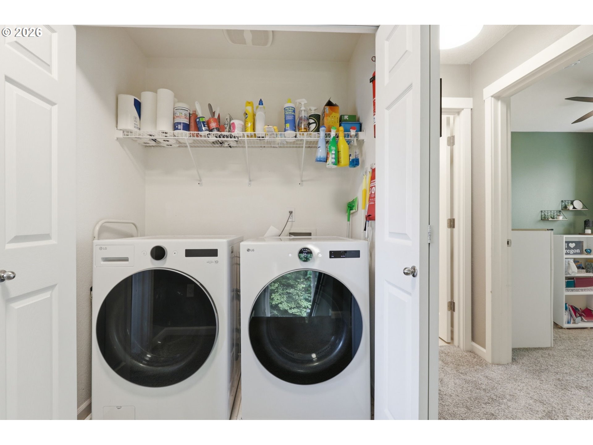 15095 Southwest Warbler Way, Unit 104 Beaverton, OR 97007 - Photo 28 of 46 a utility room with dryer and washer