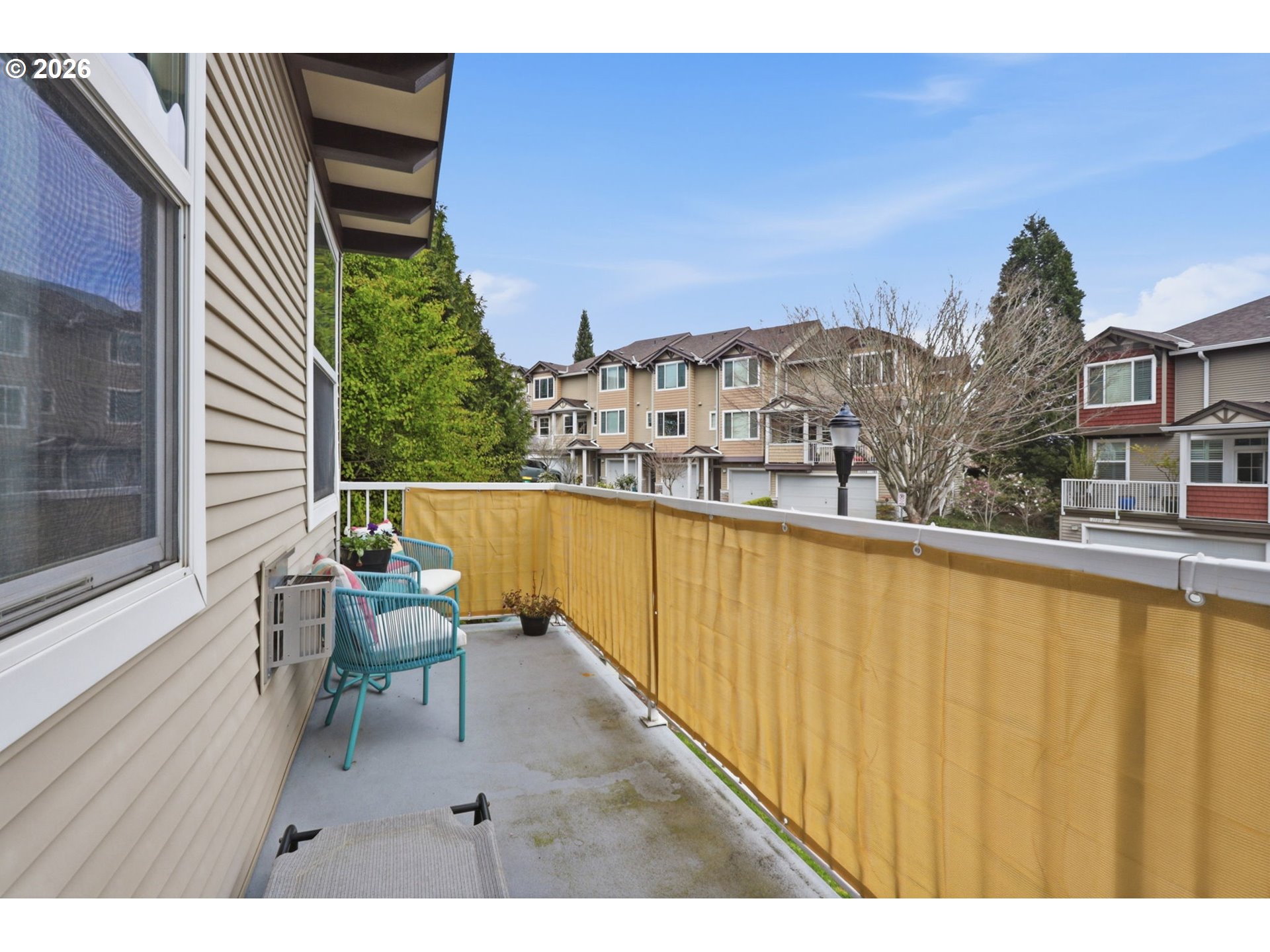 15095 Southwest Warbler Way, Unit 104 Beaverton, OR 97007 - Photo 34 of 46 a view of a balcony with chairs