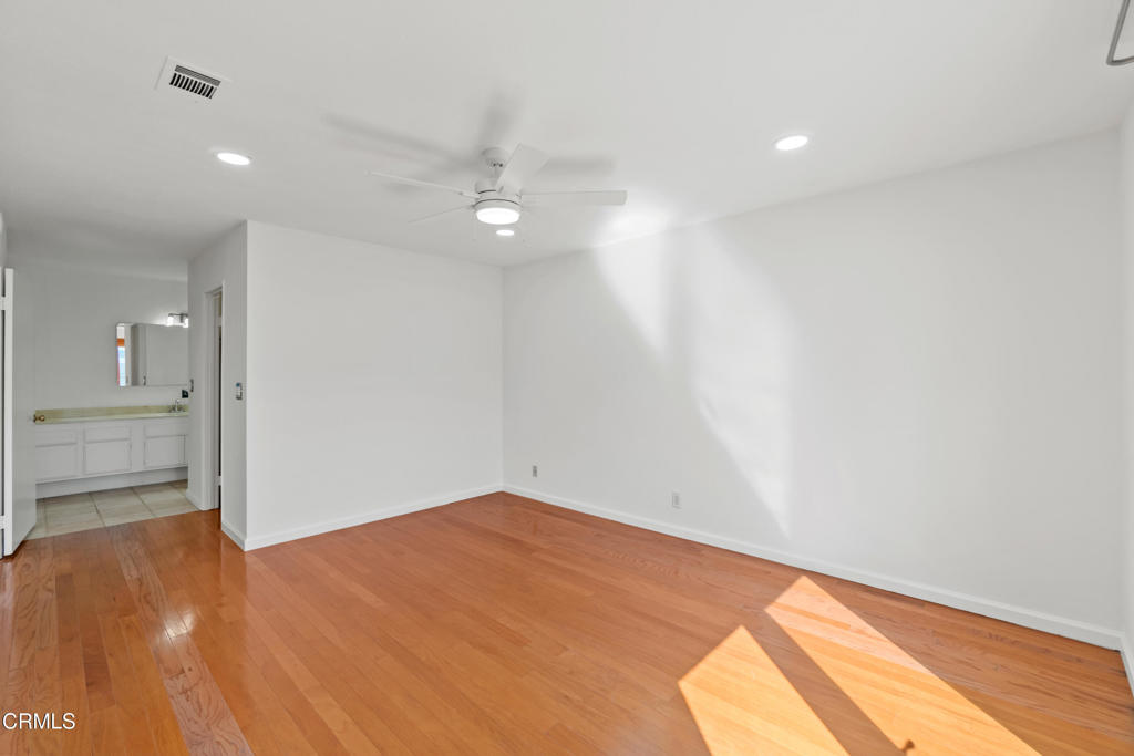 426 Reed Way Port Hueneme, CA 93041 - Photo 26 of 34 an empty room with wooden floor and windows