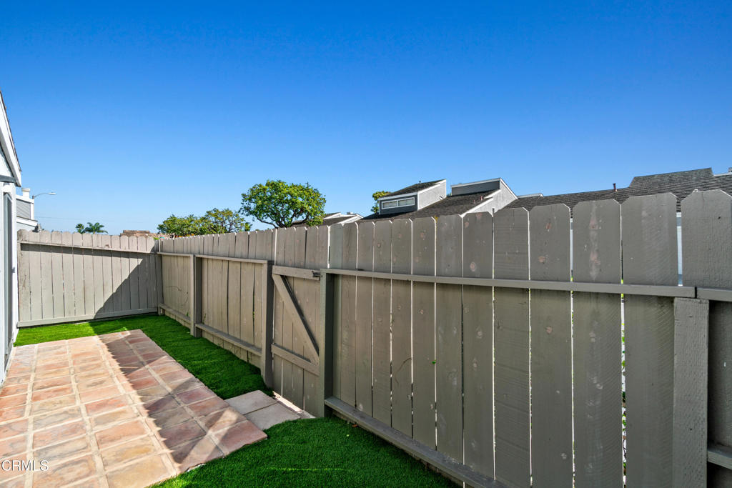 426 Reed Way Port Hueneme, CA 93041 - Photo 29 of 34 a view of a pathway with a wrought fence