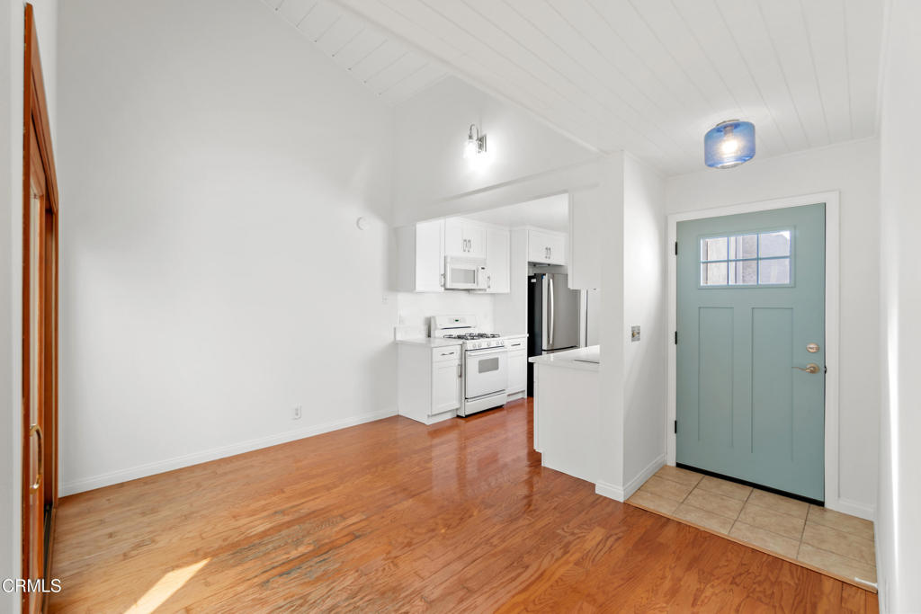 426 Reed Way Port Hueneme, CA 93041 - Photo 7 of 34 a view of a kitchen with refrigerator and microwave