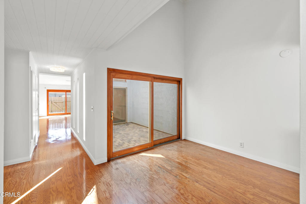 426 Reed Way Port Hueneme, CA 93041 - Photo 8 of 34 an empty room with wooden floor and windows