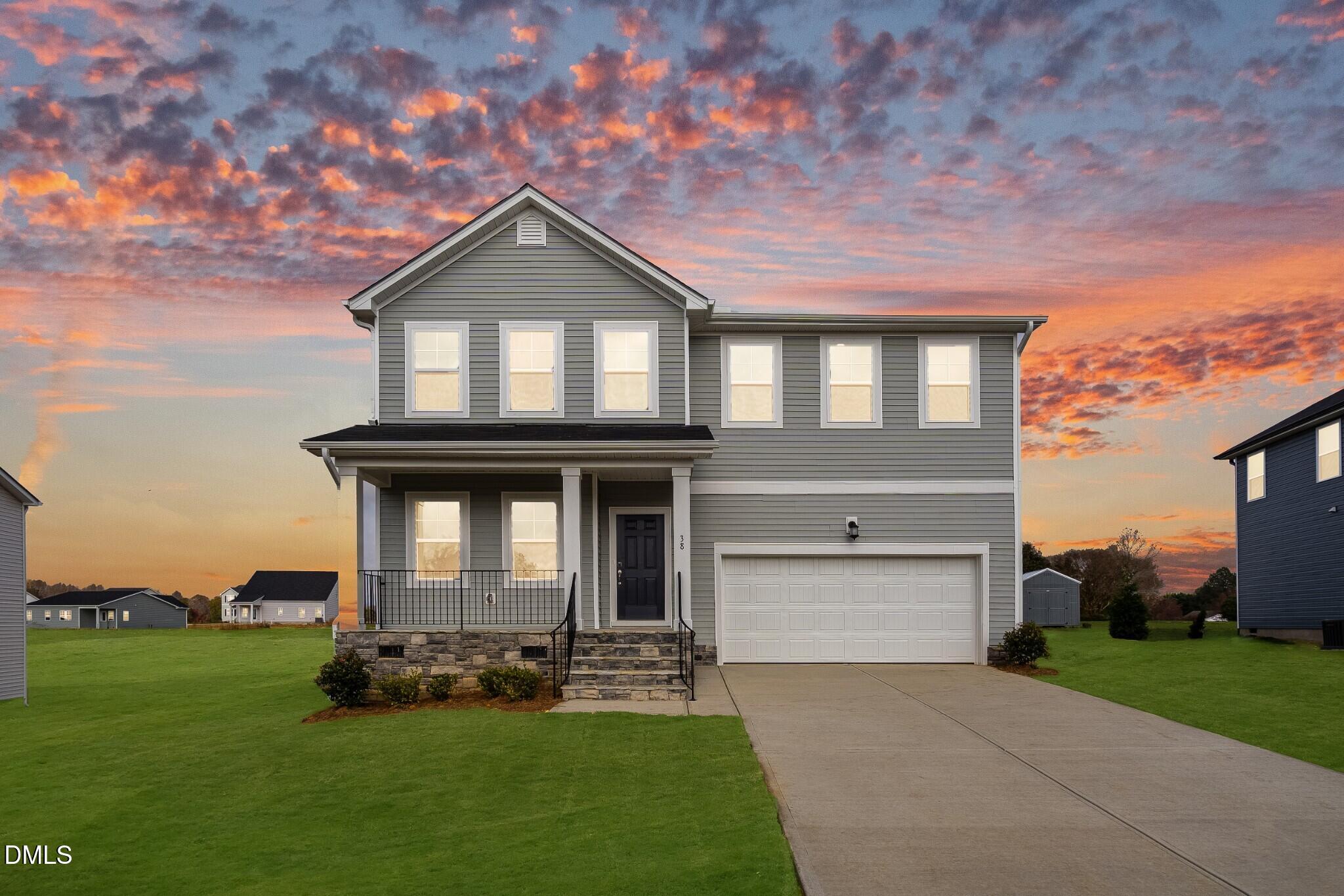 654 Roy Adams Road Angier, NC 27501 - Photo 2 of 38 front view of a house with a yard