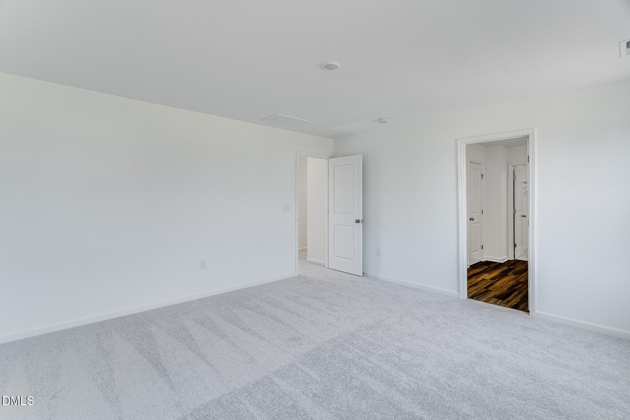 654 Roy Adams Road Angier, NC 27501 - Photo 30 of 38 a view of room with walk in closet