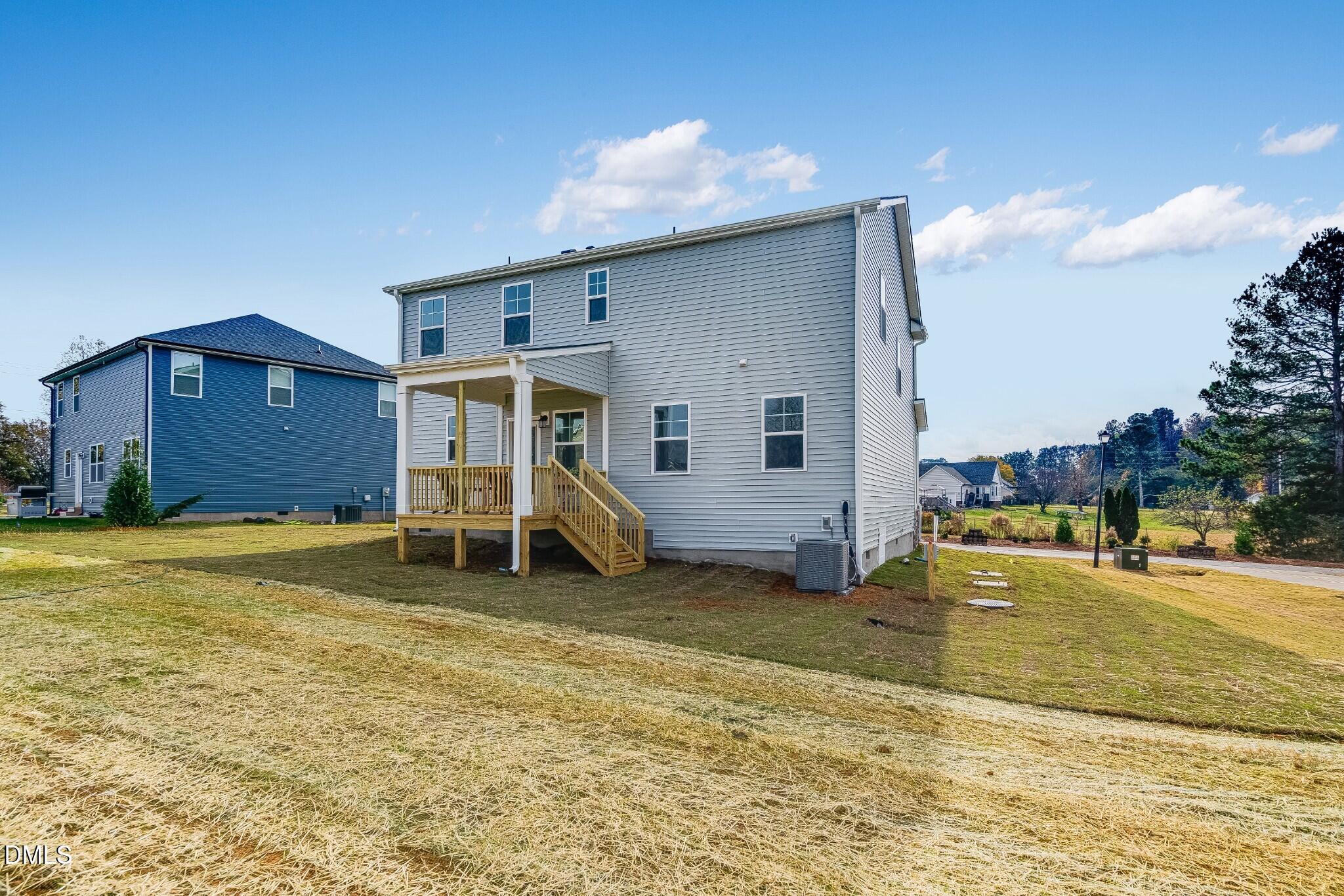 654 Roy Adams Road Angier, NC 27501 - Photo 36 of 38 a view of a house with a backyard