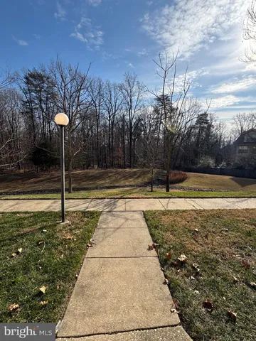 a view of a swimming pool with a yard