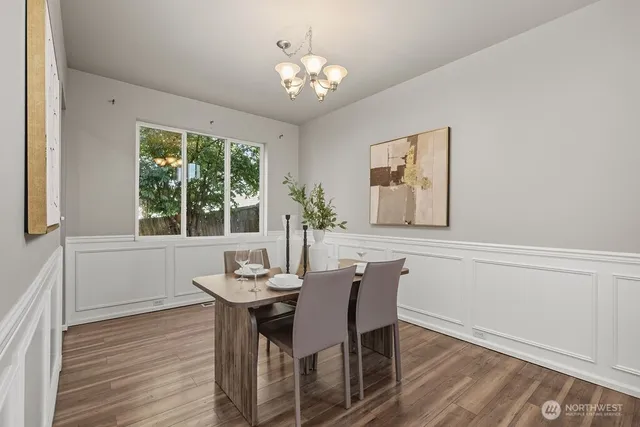 a dining room with furniture and window