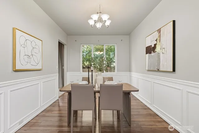 a view of a dining room with furniture window and wooden floor