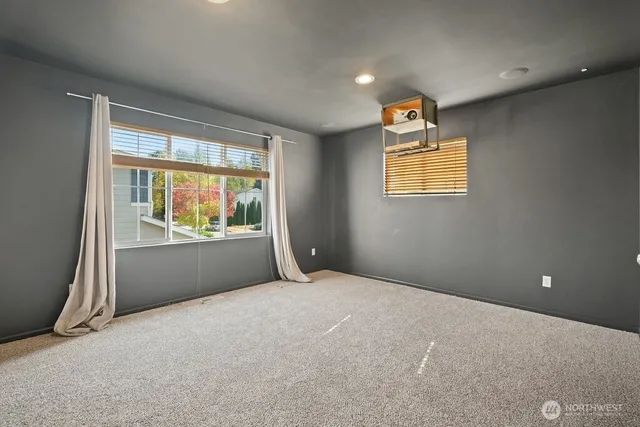 a view of room with a window and furniture