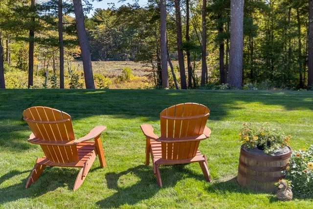 a view of a table and chairs in the garden