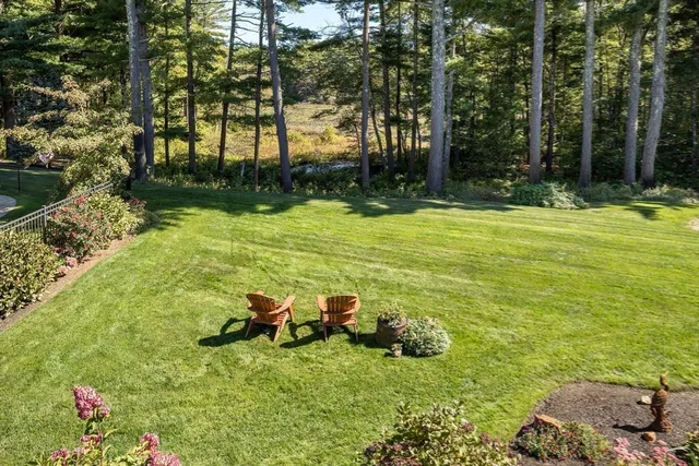 a backyard of a house with lots of green space