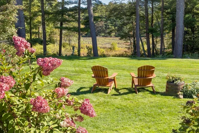 a view of a table and chairs in the garden