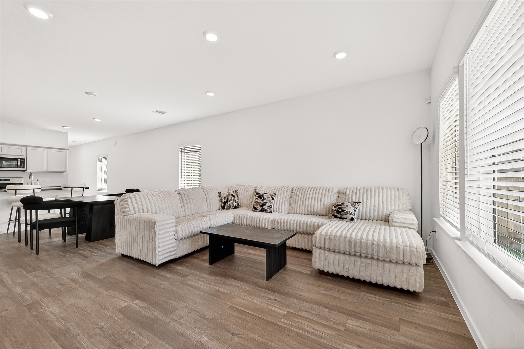 5442 Pinetree Cres Lane Spring, TX 77373 - Photo 23 of 24 The open concept floor plan creates an inviting living space, seamlessly connecting the kitchen, dining and living areas for effortless everyday living and entertaining