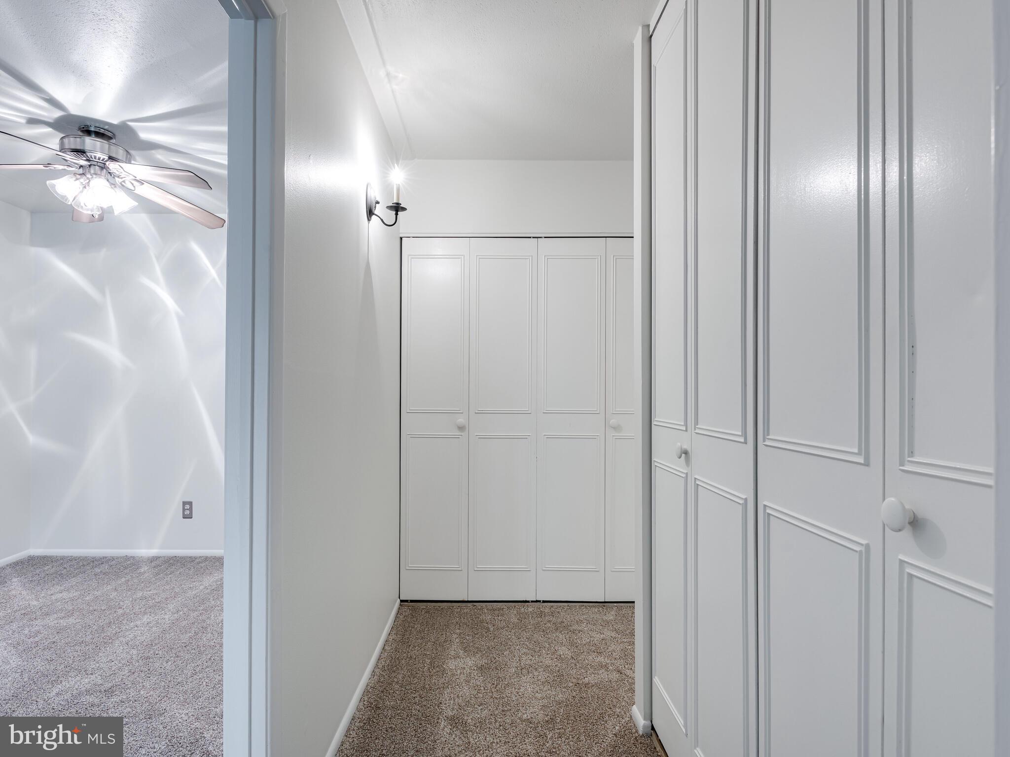 93 Old Forge Crossing, Unit 93 Devon, PA 19333 - Photo 21 of 34 Hallway to Laundry and Bath