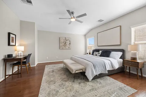 a bedroom with a bed and a table