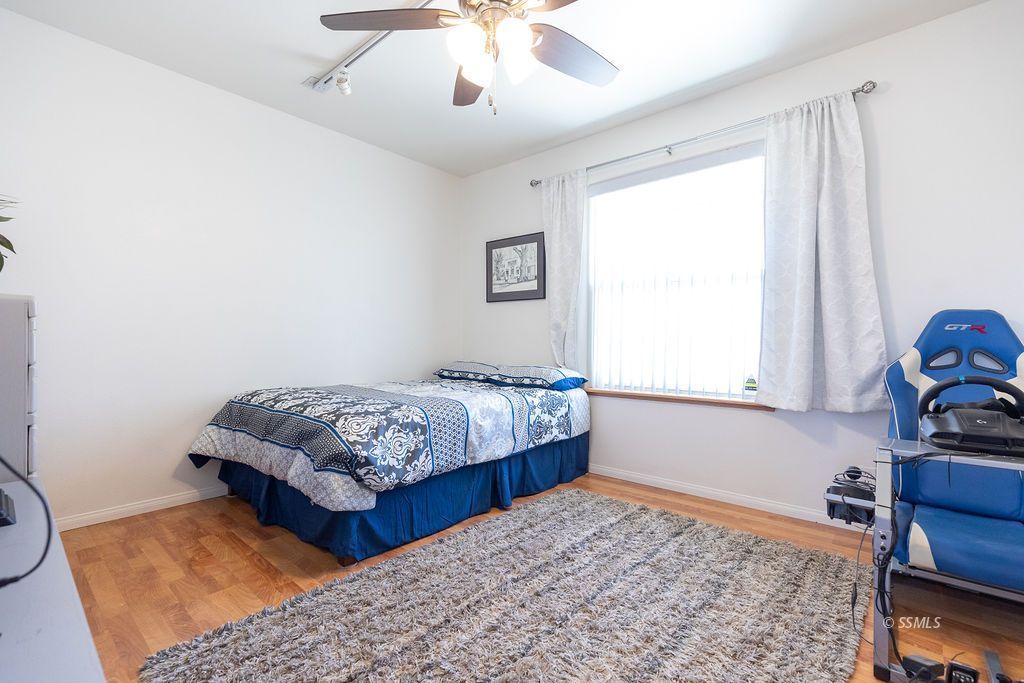6542 Ridgecrest Boulevard Inyokern, CA 93527 - Photo 24 of 50 a bedroom with bed and a window