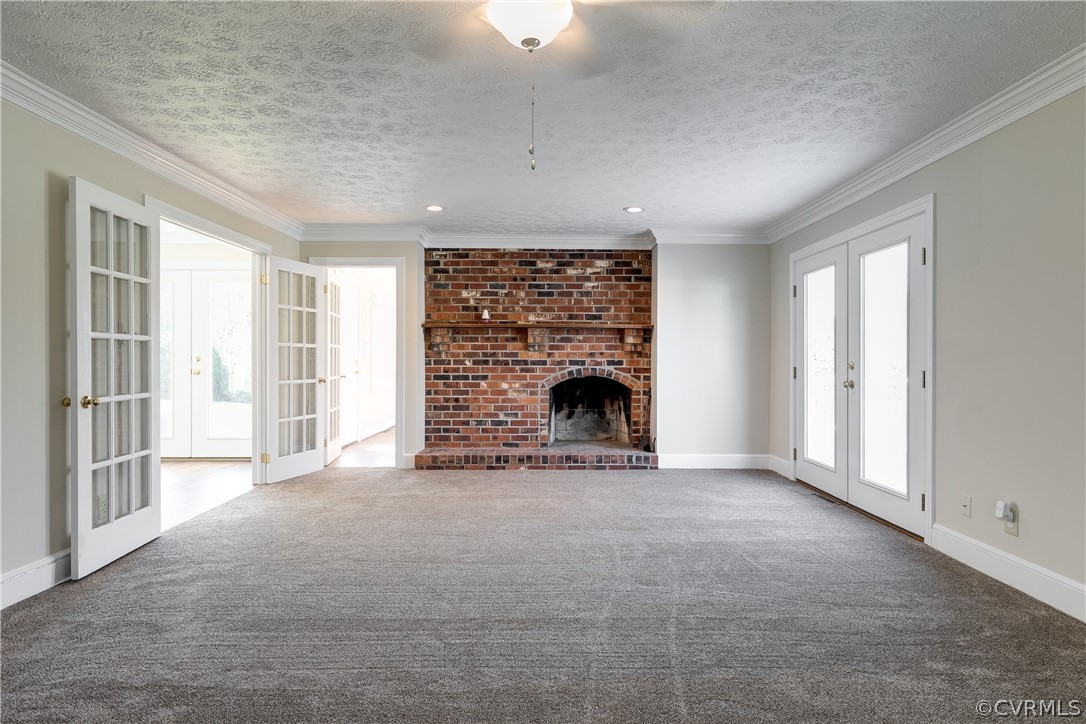 17523 Old Ridge Road Montpelier, VA 23192 - Photo 8 of 50 a view of an empty room with a fireplace and a window