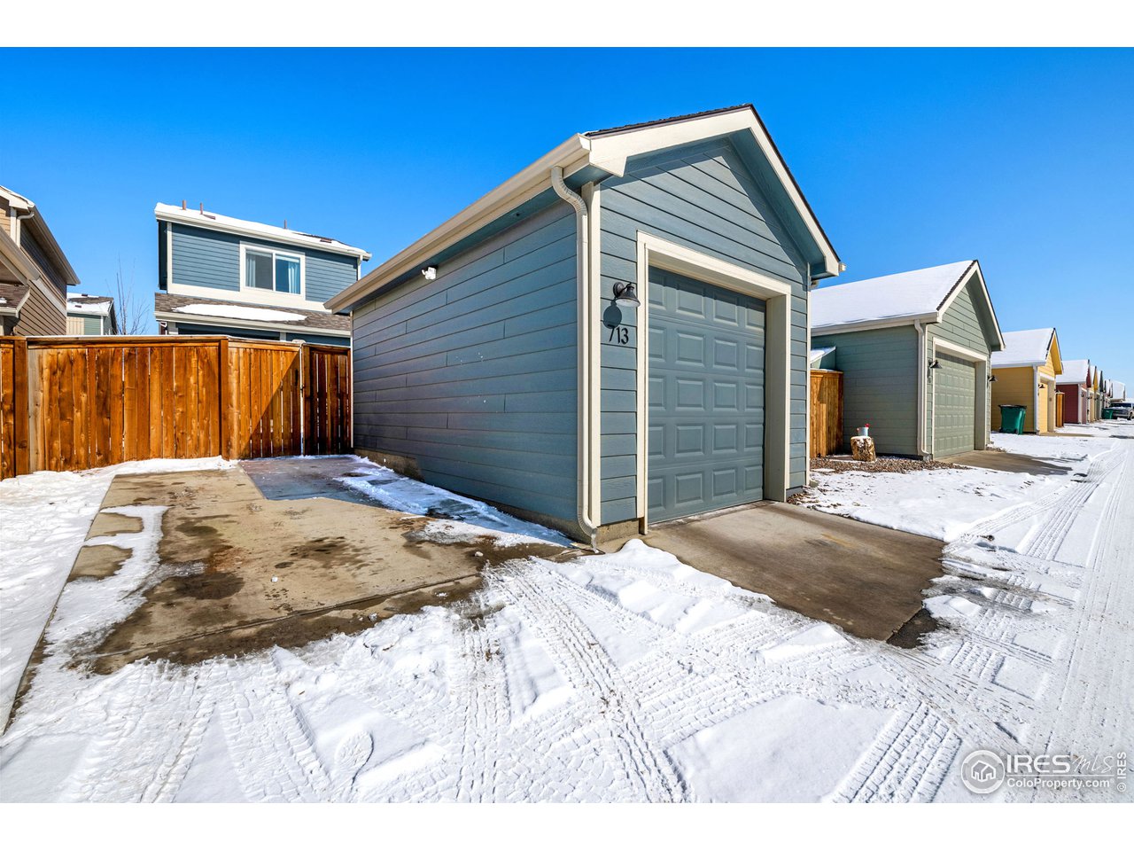 713 Country Rd Trail Berthoud, CO 80513 - Photo 23 of 27 1-car garage with parking pad