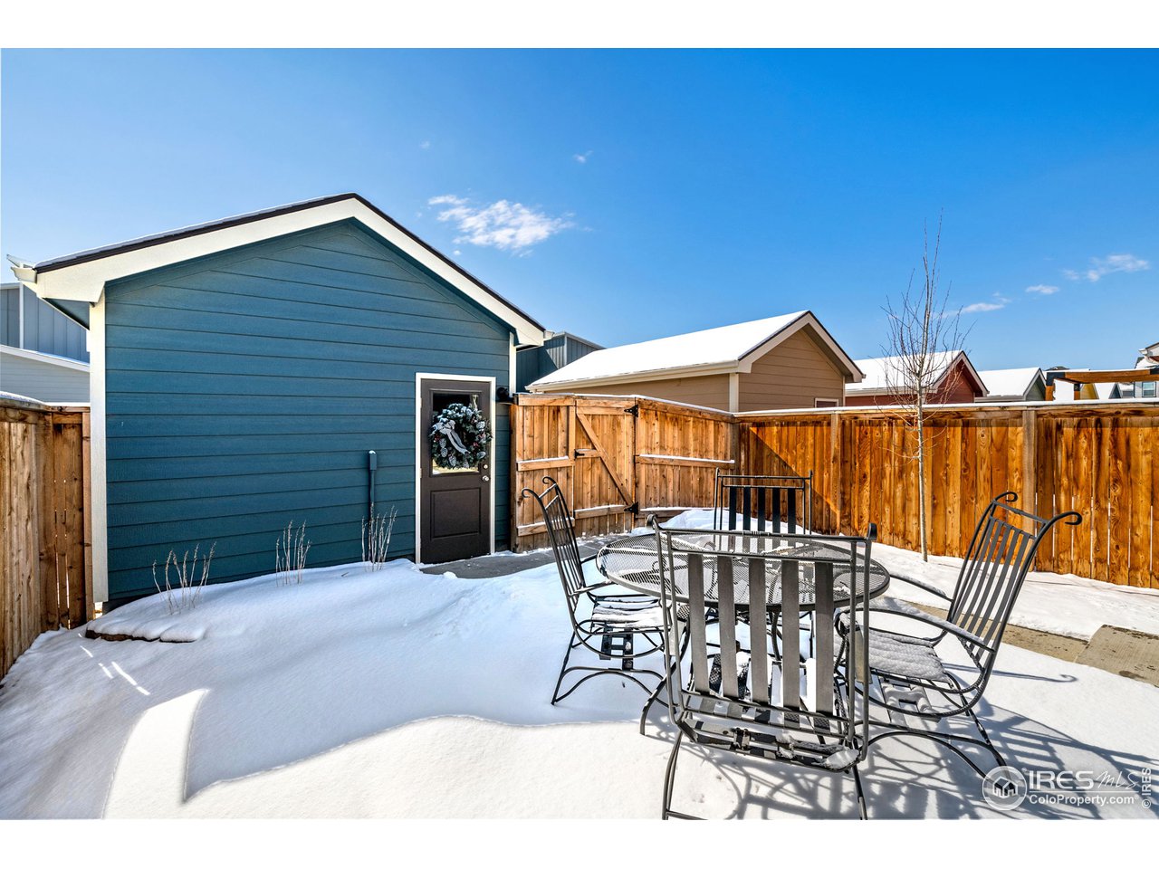 713 Country Rd Trail Berthoud, CO 80513 - Photo 25 of 27 Back yard with concrete patio seating area
