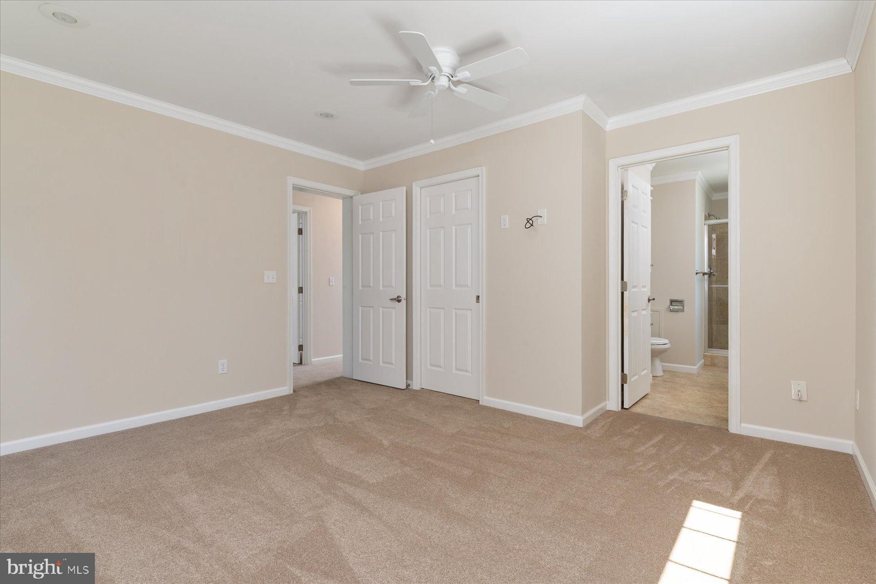 109 Calvert Road Stevensville, MD 21666 - Photo 36 of 41 Spacious, light-filled bedroom with neutral tones.