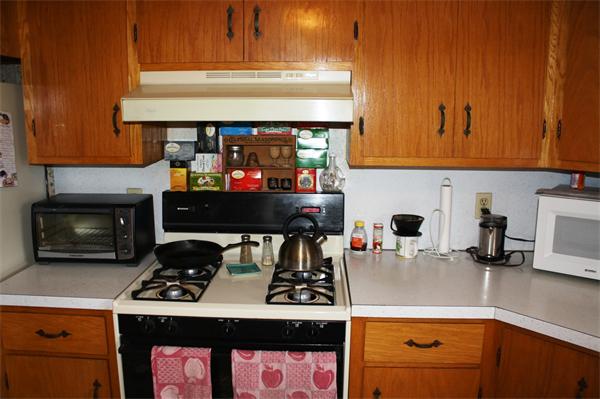 67 Ryan Road Northampton, MA 01062 - Photo 6 of 19 a kitchen with a stove and a white cabinets